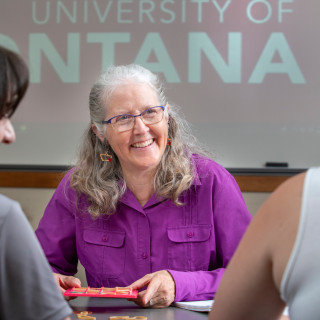 Faculty member smiling at students