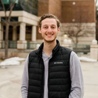 Image of Connor smiling ready to help you make Missoula your next adventure