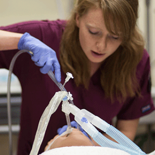 Student practicing respiratory care 