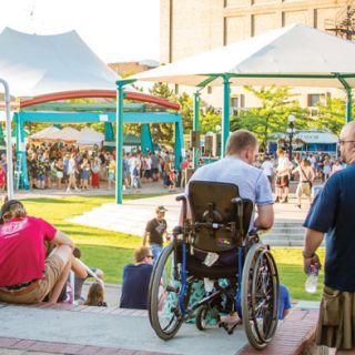 man on a wheelchair participating in community event