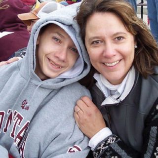 Mother with here special needs son smiling