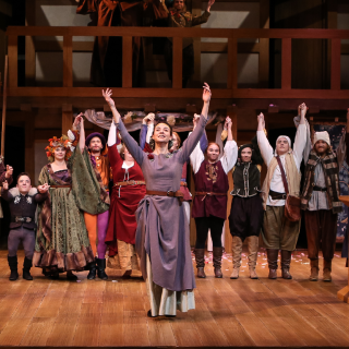 The 2017 cast of "As You Like It" raising their arms at curtain call. 