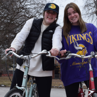 two girls posing with their new bike rentals