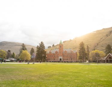 Sunrise over UM's Main Hall and lush green space