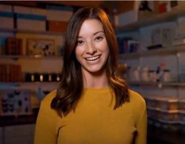 UM student Andi Newbrough looks at the camera while speaking as she stands in the Emlen Lab on campus.