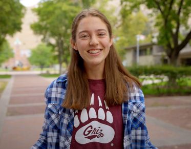 UM student Katherine Wendeln speaks at the camera while standing on UM's Ryman Mall.