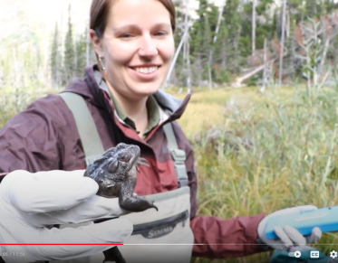 Leah holding a spotted frog