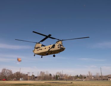 A Chinook helicopter lifts off from Riverbowl at UM.