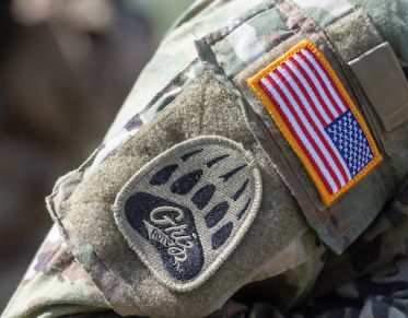 An ROTC student wears the Grizzly Battalion patch on his uniform