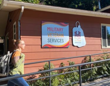 A student walks into the Military and Veterans Service Office at UM
