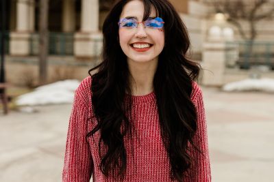 Image of Talia smiling ready to help you make Missoula your next adventure