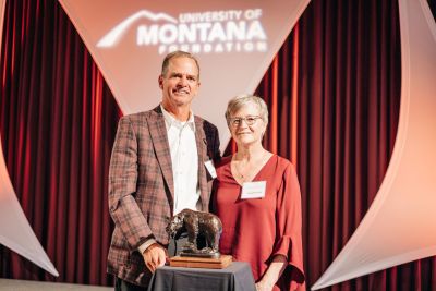 A picture of Mark and Cheryl Burnham with the Order of the Grizzly Award. 