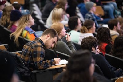 A picture of many students in class at UM.