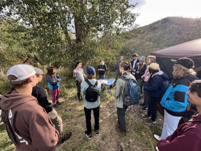 UMBEL staff speaks with members of the Bitterroot Bird Alliance at MPG Ranch in 2024.