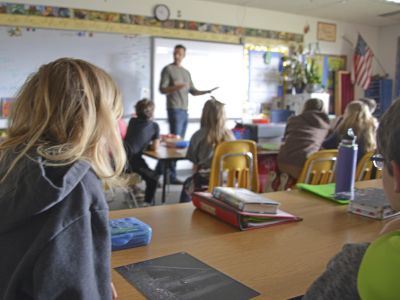 Faculty member teaching in an elementary classroom.