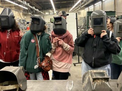 Middle school students in welding face shields at Missoula College 