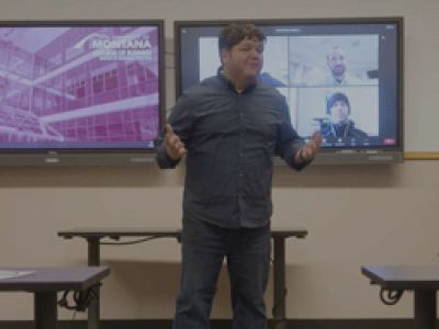Dr. Jason Triche in front of students in a classroom