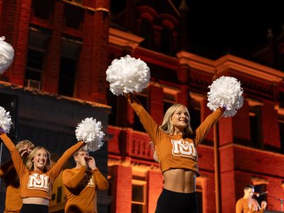 Maroon Interlocking U and M sign 