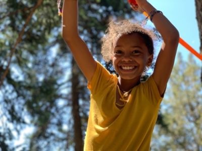 Child playing on a rope swing