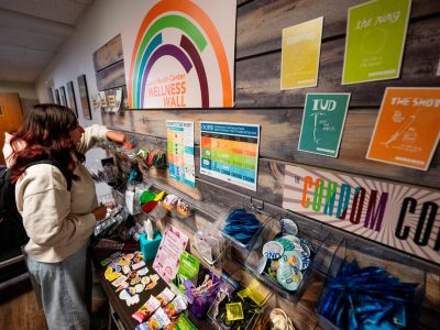photo of student at the wellness wall in curry health center