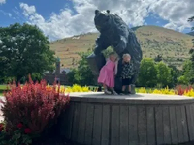two kids with the statue