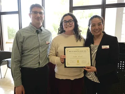 Edith Meade posing with two people