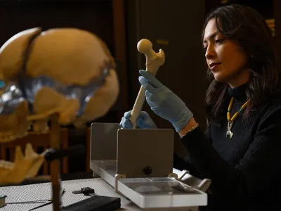 student holding a bone