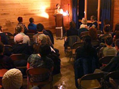 person reading to a seated group