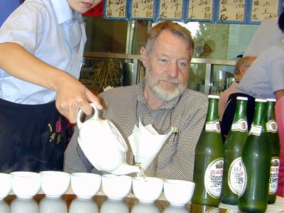 don served tea by a young chinese woman