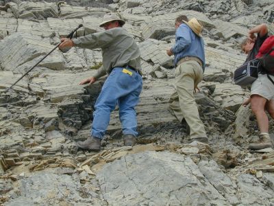 don and two others on the side of a rock face