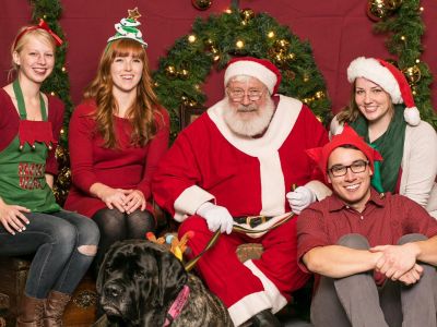 UM Gerontology Society Officers getting their photos taken with Santa at the Annual Photos with Santa Fundraiser