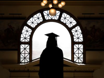 shadow of a graduate in cap and gown