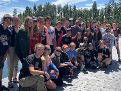 Schwanke participants posing for group photo on  a dock on Flathead Lake