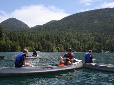 Schwanke participants in canoes doing research on Flathead Lake