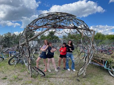 Schwanke participants standing inside dome sculpture made out of bikes