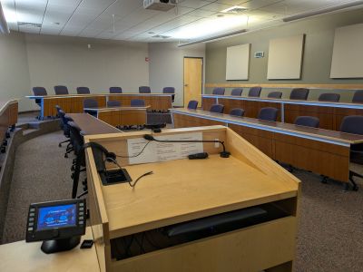 Podium in a empty classroom.