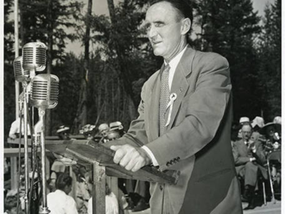 Mike Mansfield standing at a podium