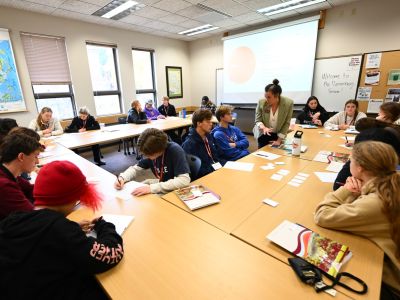 Students sitting in a group of tables