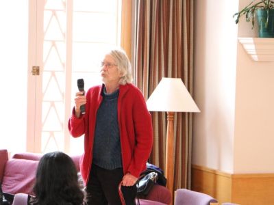 Dr. Keith Yale holds a microphone