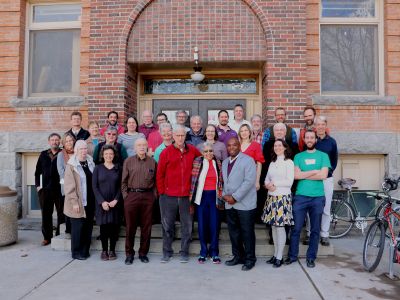Faculty and Dr. Goins pictures on the steps of the math building