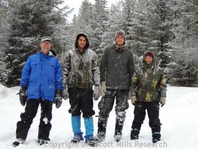 Mills lab members standing in the snow
