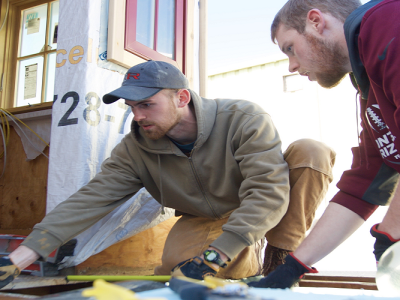 workers were measuring a board