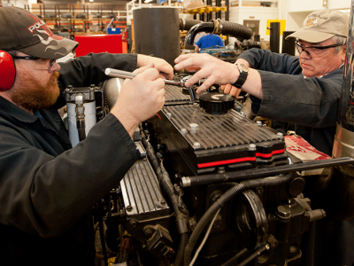 students working on an engine 