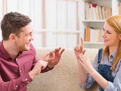 two people communicating with sign language