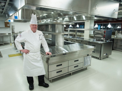 Culinary Arts Program Director Chef Thomas Campbell stands in one of three new kitchens.