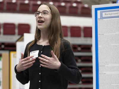 girl presenting at science fair