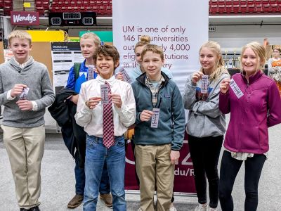 kids smiling with ribbons