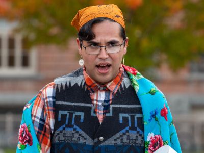 Former Kyiyo Exec and Student singing a round dance song on the oval.