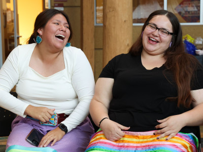 Students enjoying a game of stick game