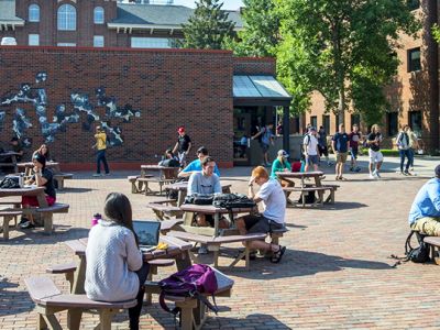Student outside sitting